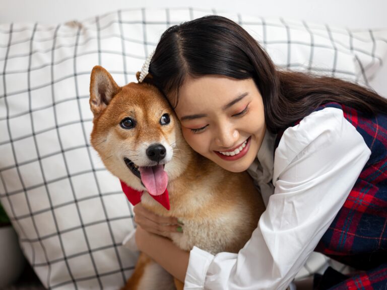 girl hugging her dog