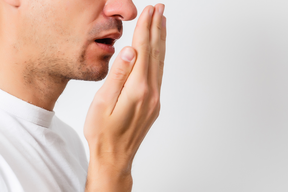 man with bad breath