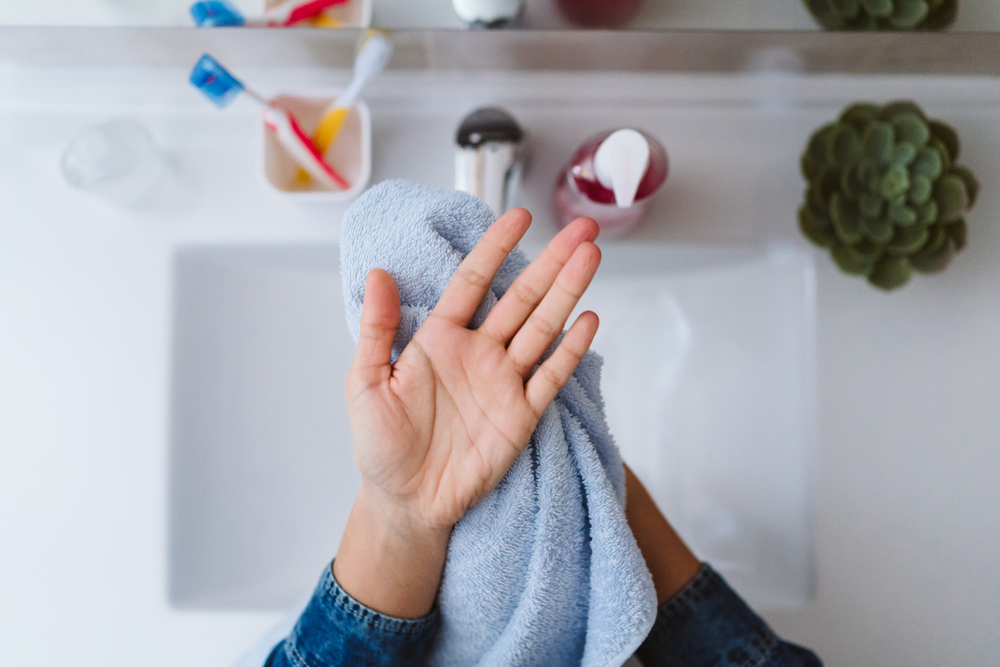 drying hands with a cloth