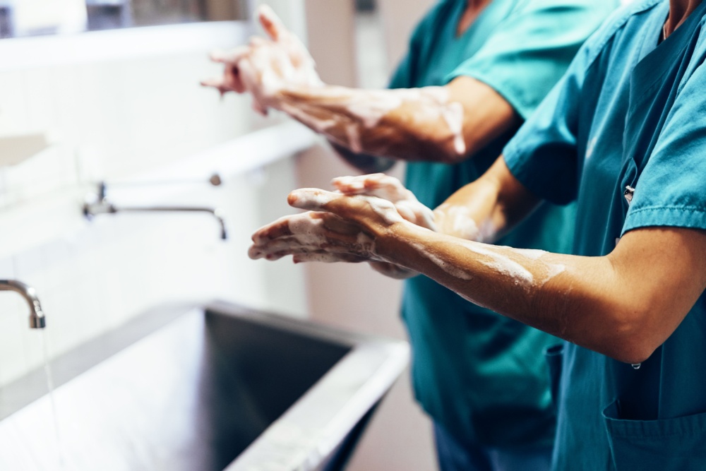 healthcare workers using antibacterial soap