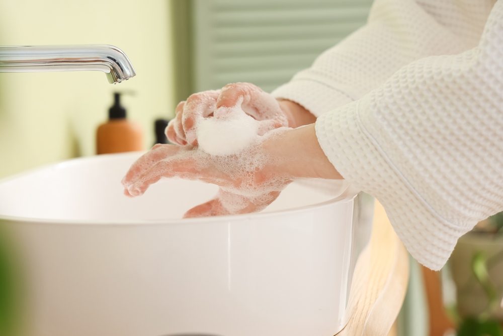 washing hands using antibacterial soap
